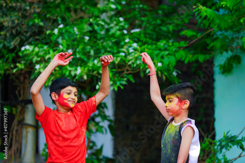 Cute indian little child’s group playing holi. Holi is colors festival in india © PRASANNAPIX