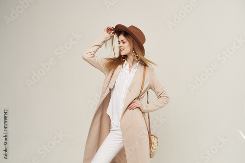 elegant woman with hat fashion attractive look style light background