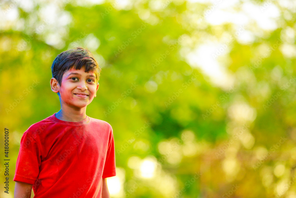 Holi celebrations -Indian little boy playing Holi and showing face expression. Holi celebrations -Indian little boy playing Holi and showing face expression.