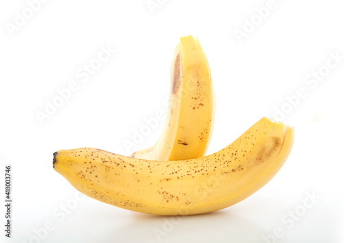 Two ripe bananas on a white background