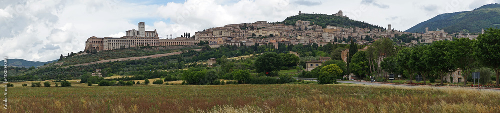 Assisi historic old town with Basilica of St. Francis on the hill panoramic view, birthplace of St. Francis, Assisi, Umbria, Italy