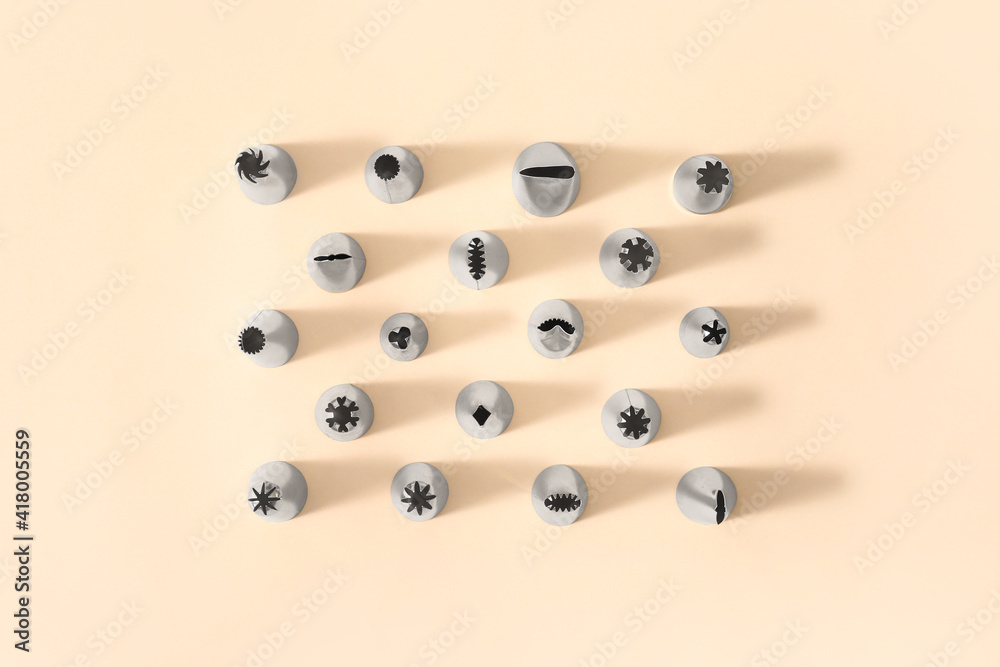 Different piping tips on color background