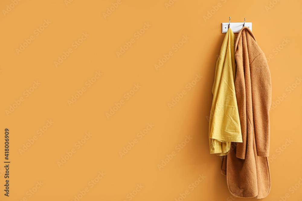 Hanger with clothes on color background Hanger with clothes on color background