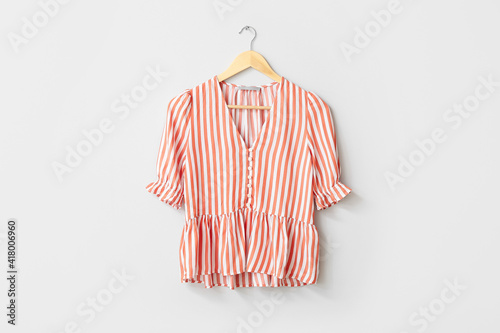 Photographie Hanger with blouse on white background