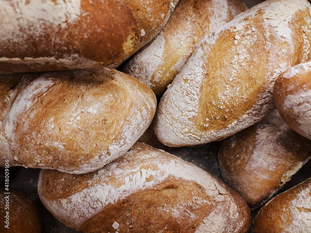 Bread on a shelf in a bakery store.