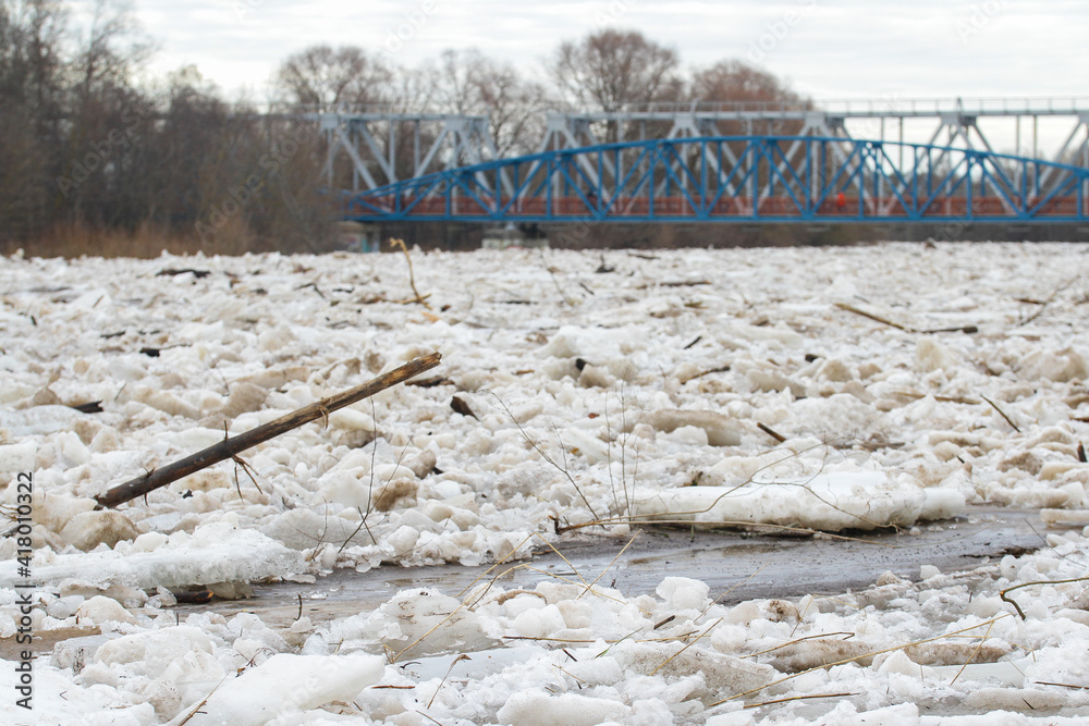 Large fragments of ice on the river bank Large fragments of ice on the river bank