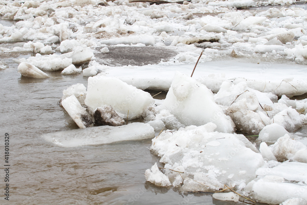 Large fragments of ice on the river bank Large fragments of ice on the river bank