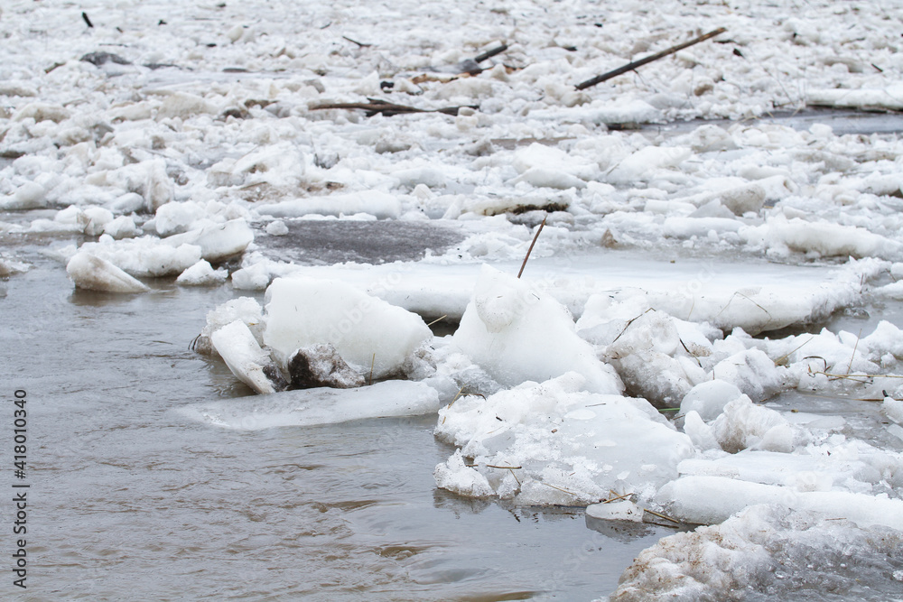 Large fragments of ice on the river bank Large fragments of ice on the river bank