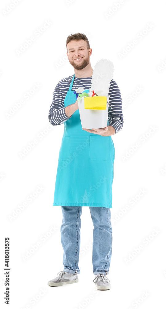 Young man with cleaning supplies on white background