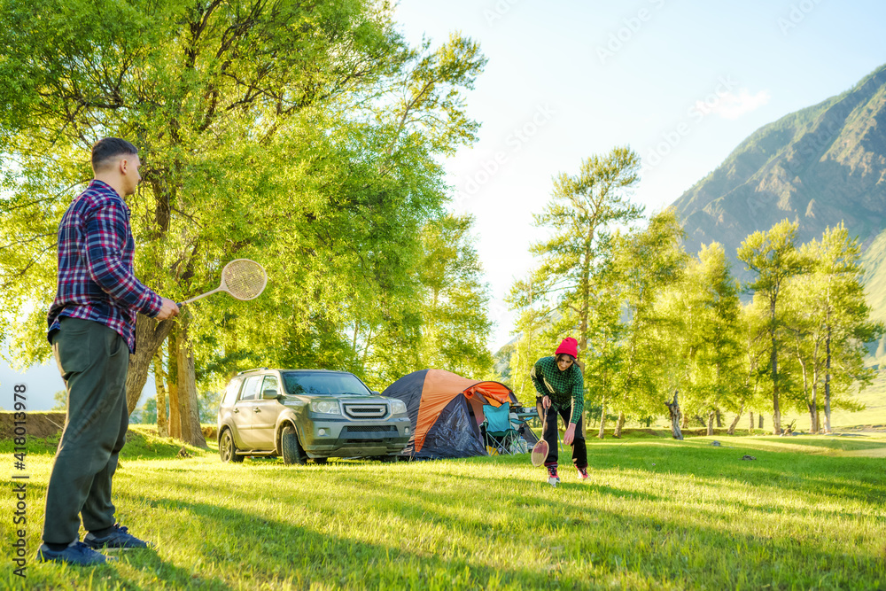 Fototapeta premium people playing in badminton on the campground