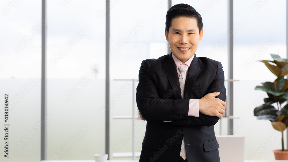 Adult Asian businessman showing workplace Adult Asian businessman showing workplace