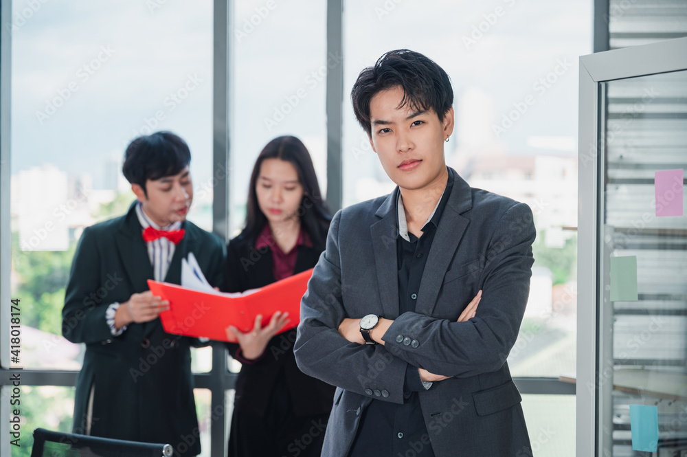 Group of confident and smart LGBT business people in formal attire sit at their desks. There's a laptop in the background. Concept of relaxation. The concept of diversity, race and culture. Group of confident and smart LGBT business people in formal attire sit at their desks. There's a laptop in the background. Concept of relaxation. The concept of diversity, race and culture.