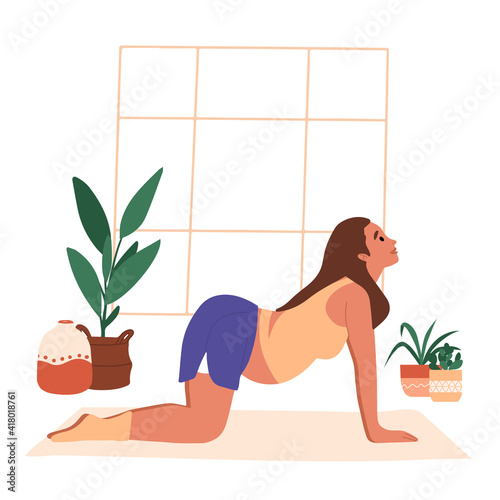 Pregnant woman in sportswear doing stretching physical exercises. Young mother with belly practicing prenatal yoga exercise class at home or gym. Relaxation, stretching, working out.