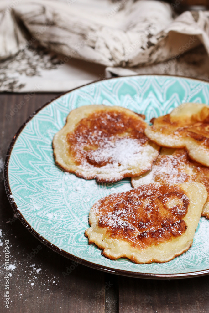 Traditional apple fritters on the plate. Traditional apple fritters on the plate.