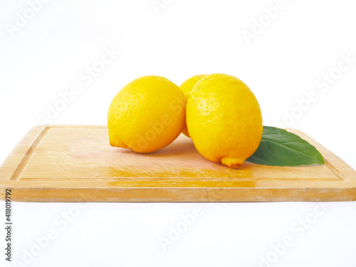 Lemons on the wooden cutting board