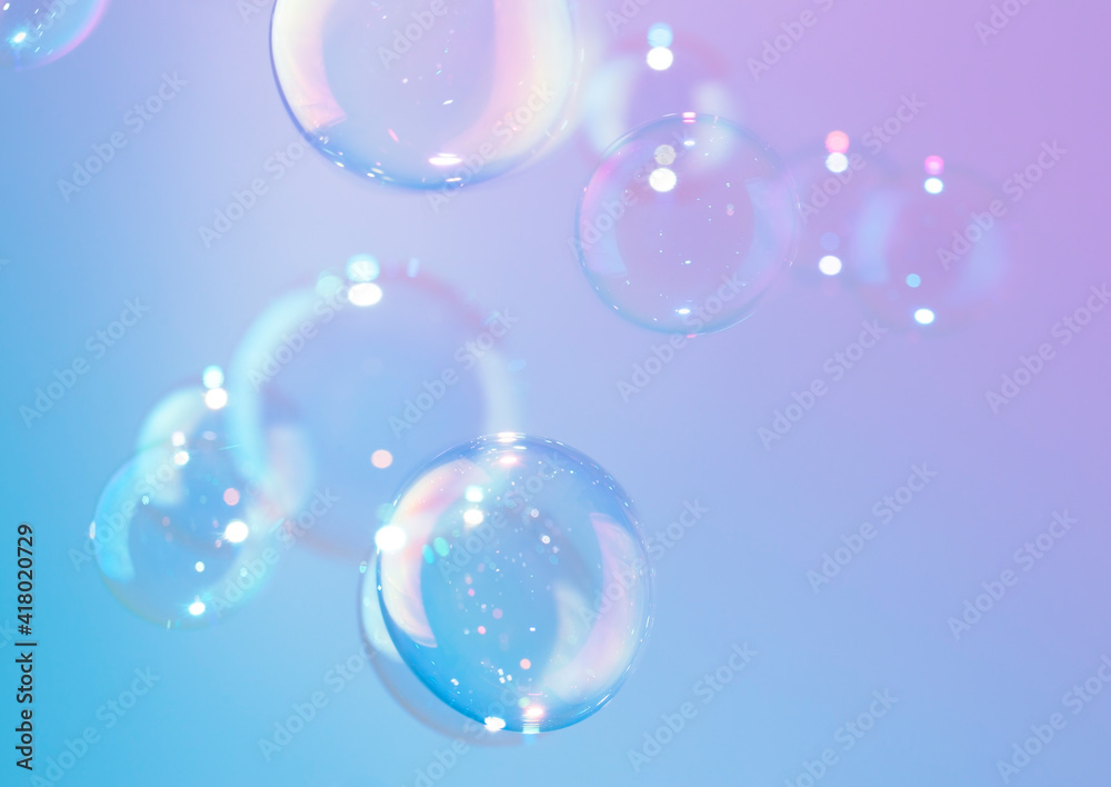 Beautiful shine bright of colorful soap bubbles float background. 