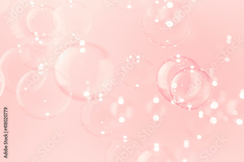 Natural freshness of blur bueatiful transparent soap bubbles float on pink background.