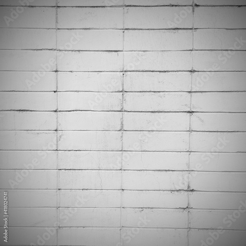 White brick wall. Square shaded background. Abstract wallpaper. 