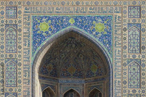 Beautiful intricate floral and geometric mosaic on iwan of ancient Tilya Kori madrassa in UNESCO listed Samarkand, Uzbekistan