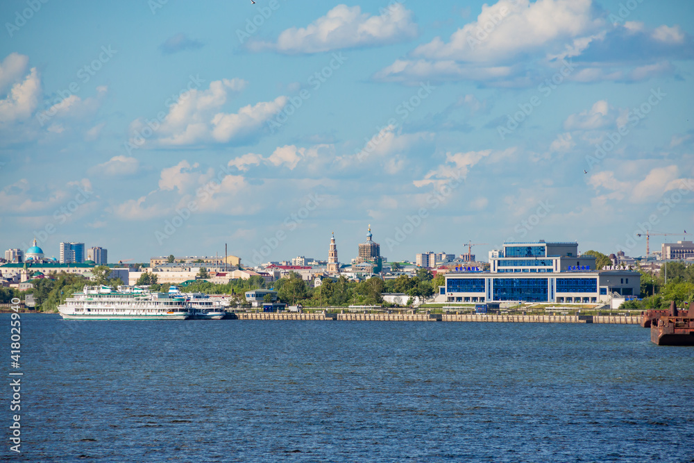 Passenger river port in Kazan on the Volga River. Tatarstan, Russia. A sunny summer day. Two three-deck passenger ships in the background.