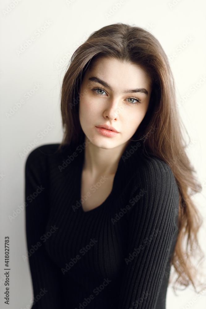 vogue style portrait of a beautiful gentle woman on a white background. Beauty portrait, tests in a bright studio. vogue style portrait of a beautiful gentle woman on a white background. Beauty portrait, tests in a bright studio.