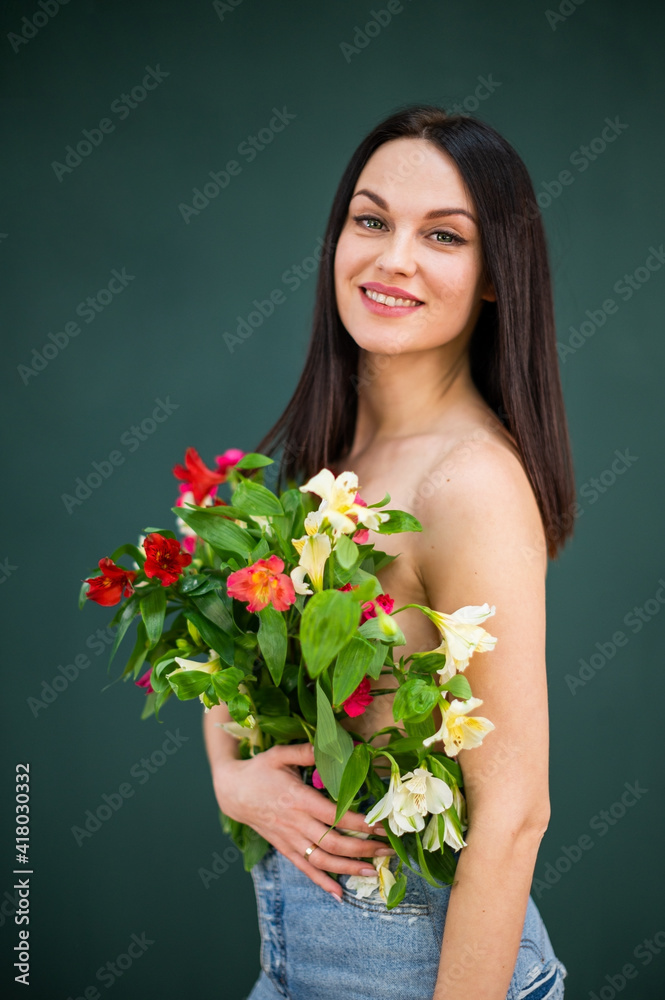 beautiful girl with dark hair and flowers instead of clothes beautiful girl with dark hair and flowers instead of clothes