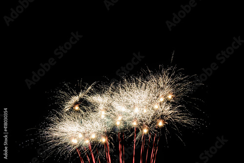 Image with a black background prepared to edit text of a firework, formed by a star of several branches of raw white color accompanied by red traces and points.