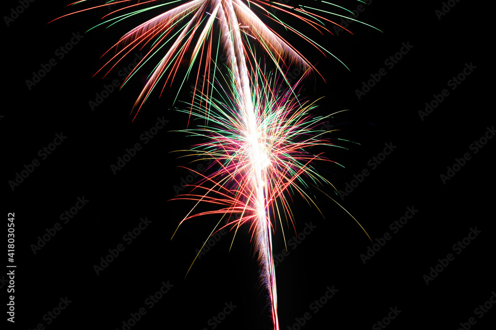 Image with a black background prepared to edit text of a firework, formed by a burst and three stars with red, green and white lines