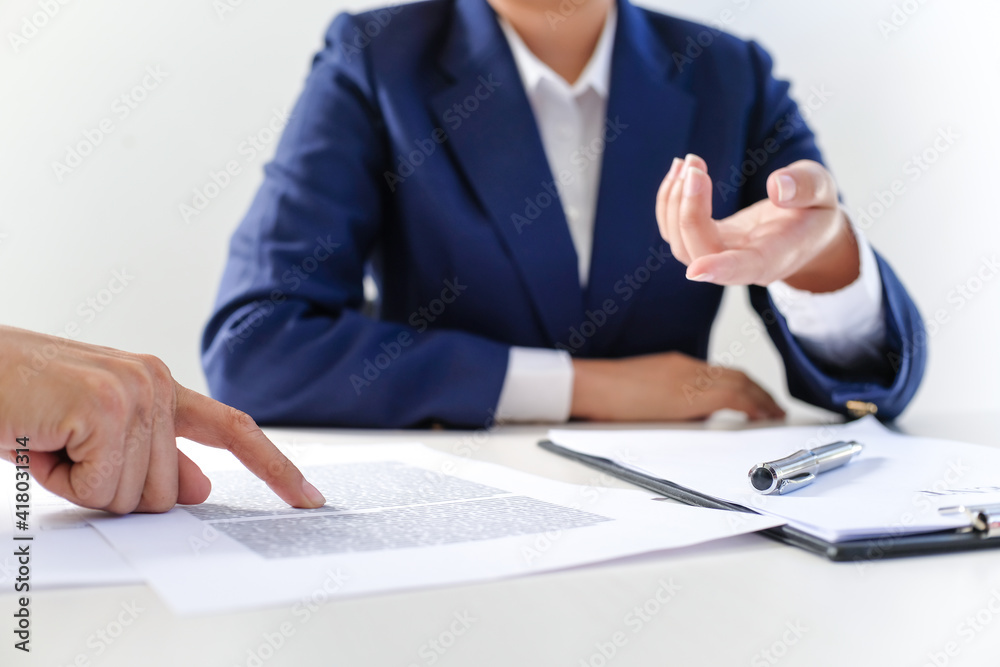 Sales manager giving advice application form document, considering mortgage loan offer for car and house insurance. Sales manager giving advice application form document, considering mortgage loan offer for car and house insurance.
