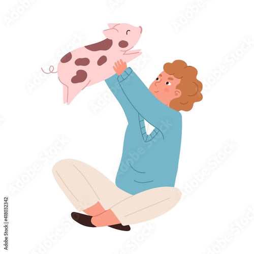 Photography Happy kid sitting with spotty piglet