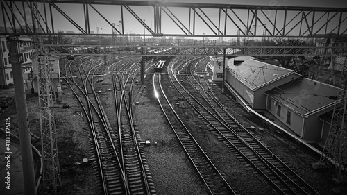 Railway. Industrial retro landscape. Station. Black and white. Metal constructions. Perspective view. Horizontal wallpaper.