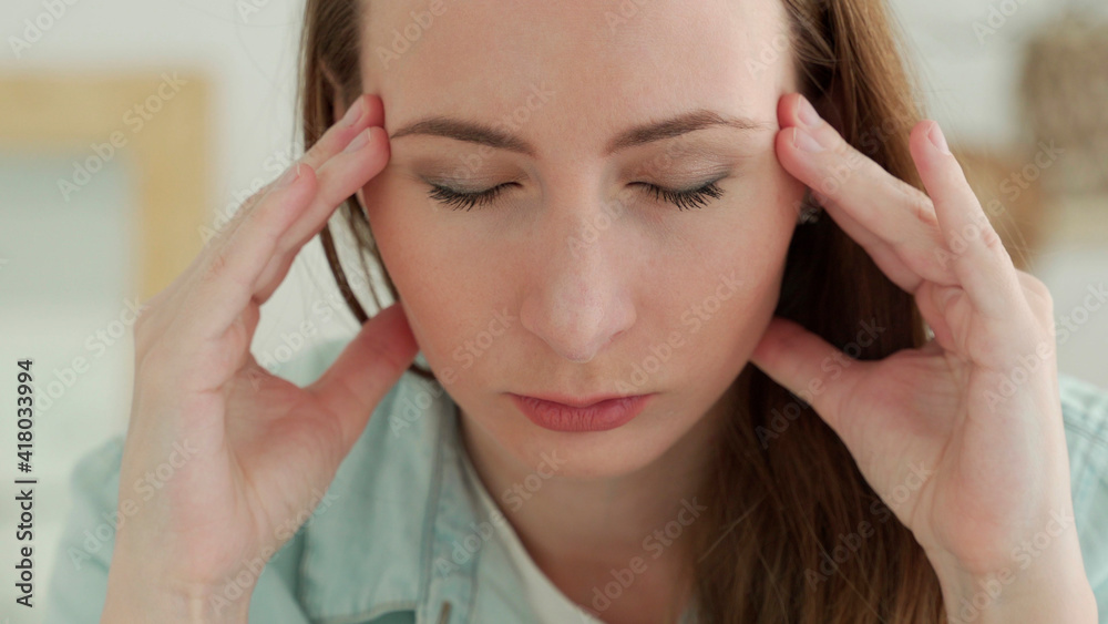 Fototapeta premium Close up of sad tired woman touching her head having headache or depression