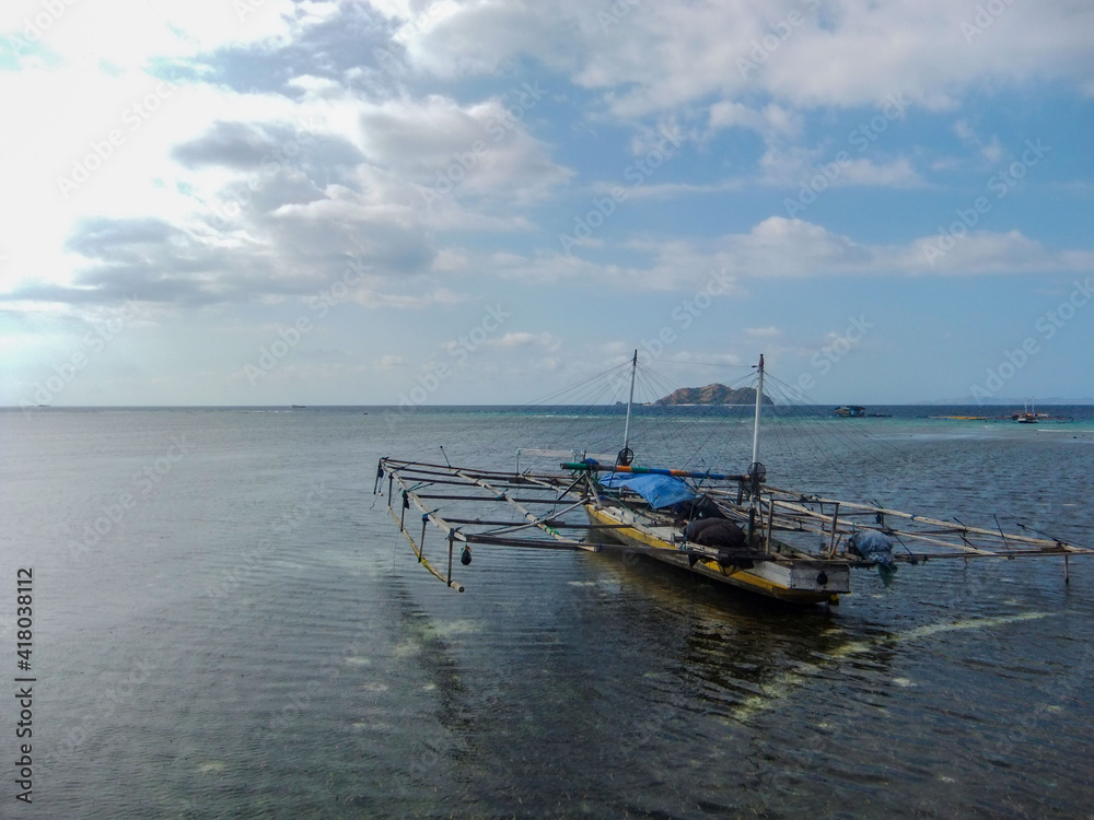 Stunning view, a boat wreck at Pulo Beach, Mesah Island Flores Indonesia