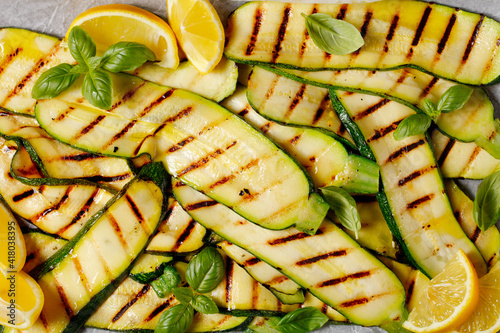 grilled zucchini slices on a sheet pan