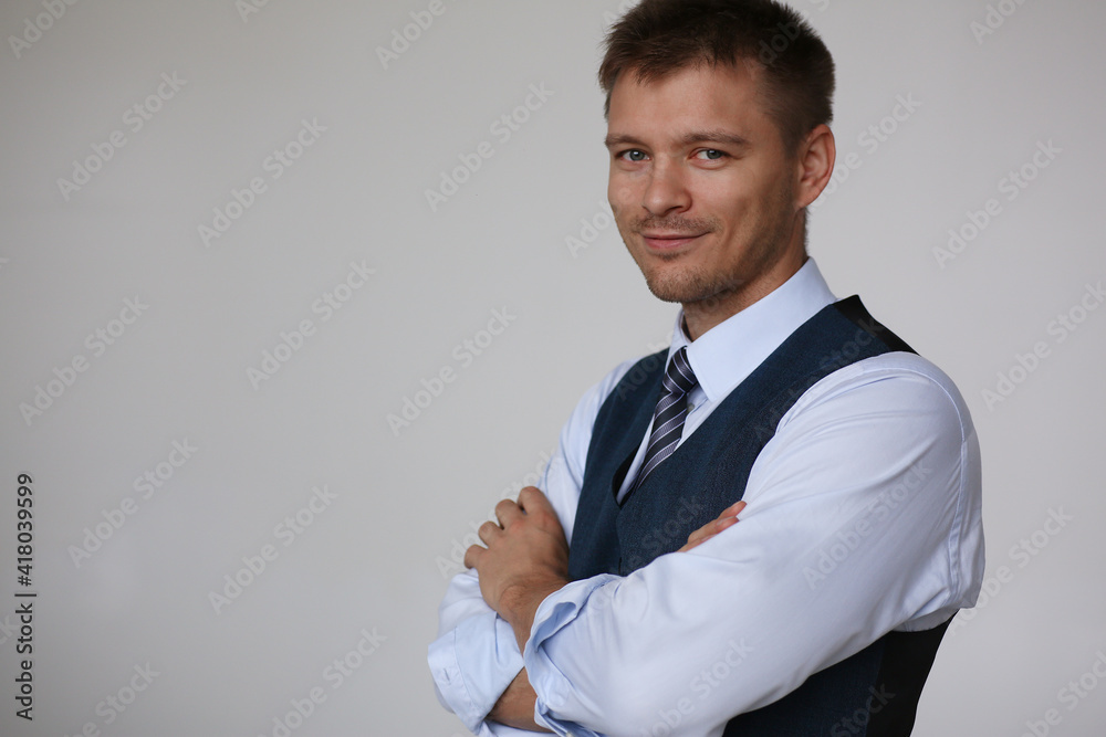 Handsome smiling man in suit and tie looking in camera portrait gray background. White collar dress code, modern office lifestyle, graduate college study, profession idea, coach training concept Handsome smiling man in suit and tie looking in camera portrait gray background. White collar dress code, modern office lifestyle, graduate college study, profession idea, coach training concept