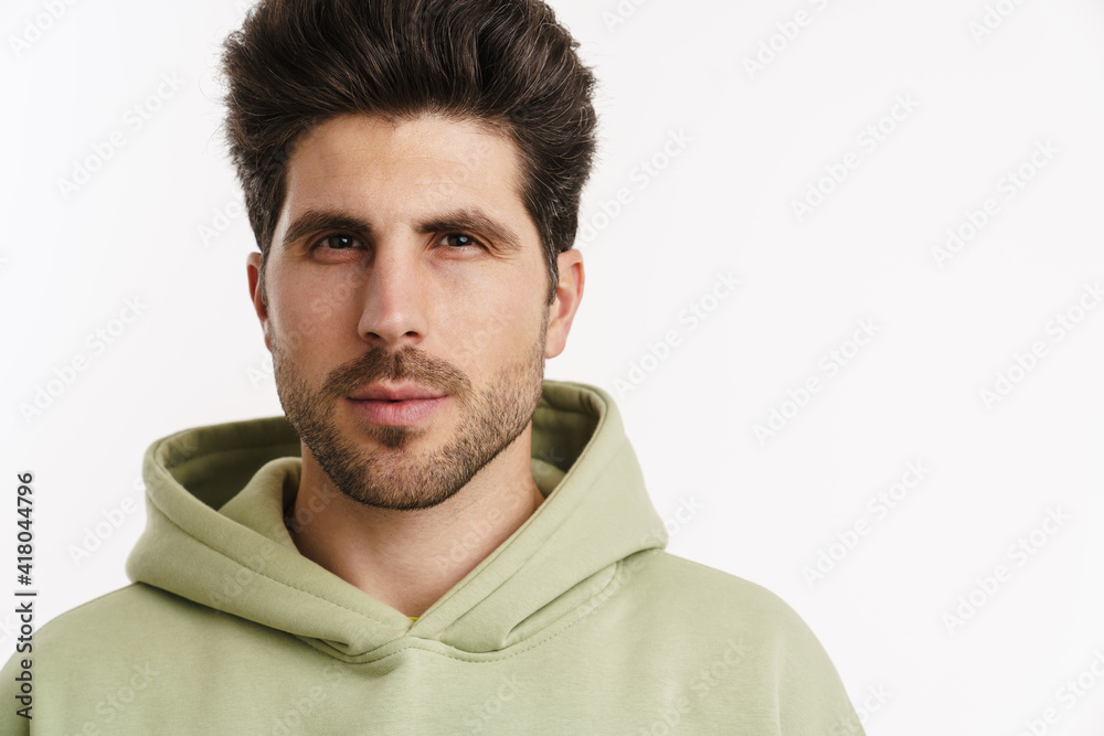 Young handsome man in sportswear posing and looking at camera Young handsome man in sportswear posing and looking at camera