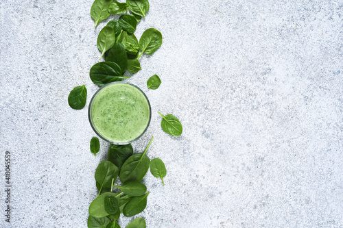 Smoothies with spinach on a concrete background. View from above. Detox drink. The keto diet.