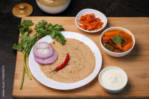 Wheat Dosa, atta or Godhuma dosa healthy breakfast meal with sambar coconut chutney . School kids tiffin for snacks break use whole wheat flour Kerala South India Sri Lanka