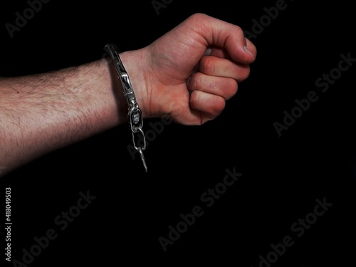 Handcuffs on arrested man hand, man loss freedom