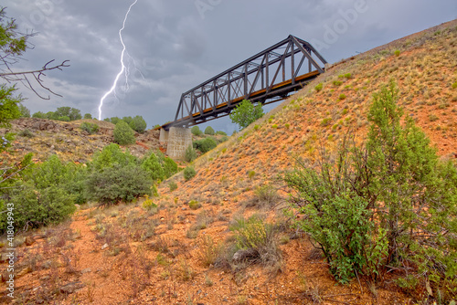 Lightning near a Trestle Railway Bridge across Bear Canyon, Perkinsville, Arizona, USA photo