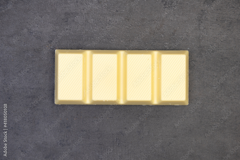sweet delicious chocolate lies on dark gray stone background sweet delicious chocolate lies on dark gray stone background