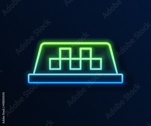 Glowing neon line Taxi car roof icon isolated on blue background. Vector.