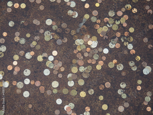 A lot of coins from different countries at the bottom of the fountain, for luck