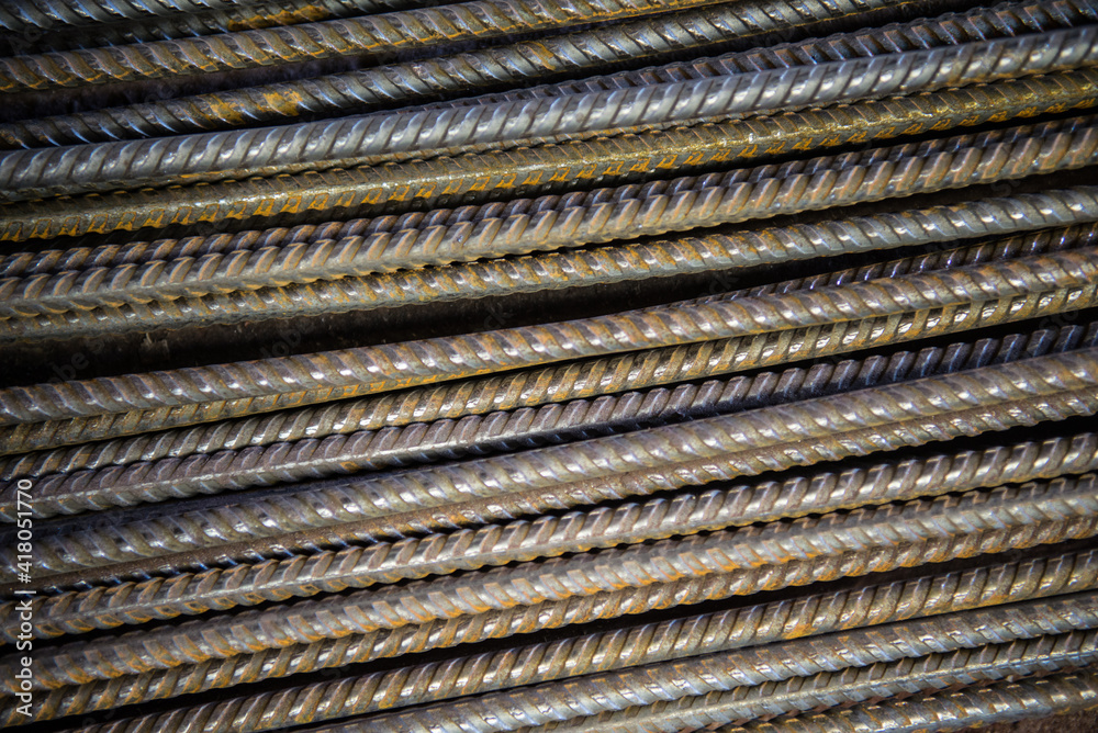 The bars of the iron rebar lie on the surface