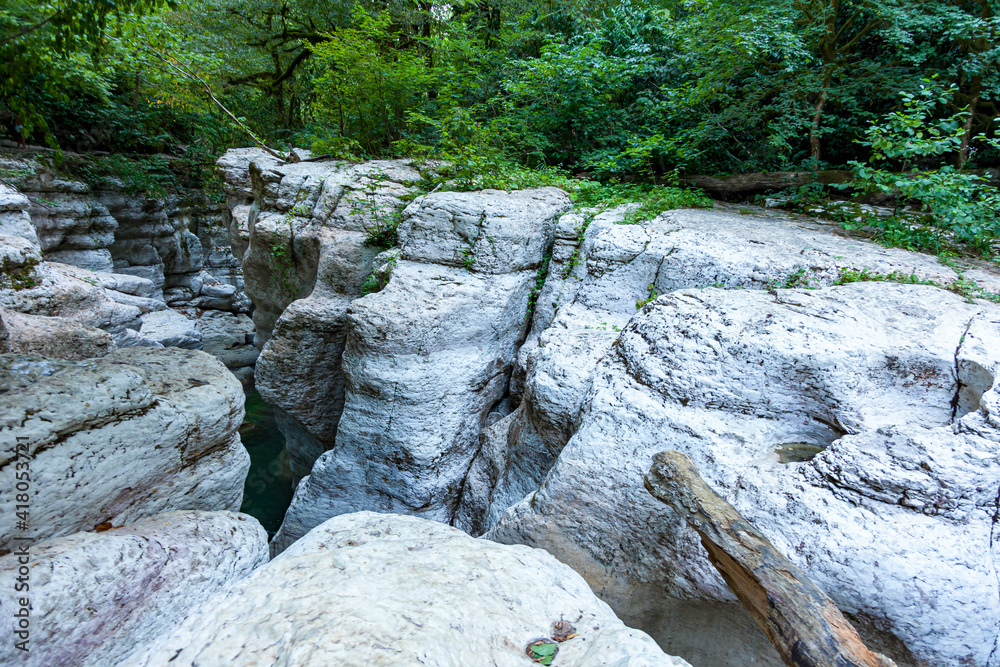 White cliffs and mountain crystal clear, shallow river in a wild place in the mountains in summer in a dense forest in summer White cliffs and mountain crystal clear, shallow river in a wild place in the mountains in summer in a dense forest in summer