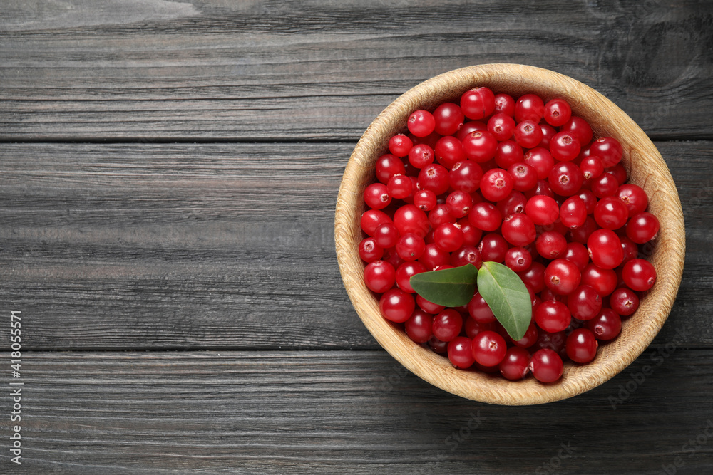 Ripe fresh cranberry on grey wooden table, top view. Space for text Ripe fresh cranberry on grey wooden table, top view. Space for text