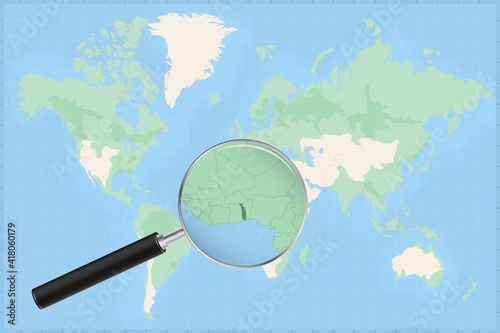 Map of the world with a magnifying glass on a map of Togo.