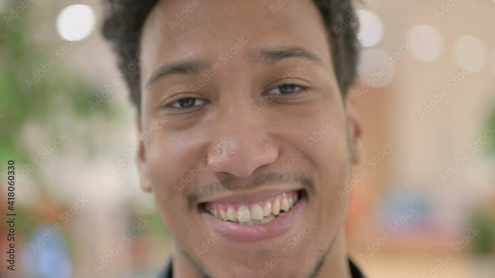 Close up of Face of African American Man Smiling at the Camera Close up of Face of African American Man Smiling at the Camera