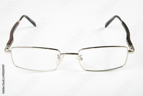 Eyeglasses with metal rim on white background