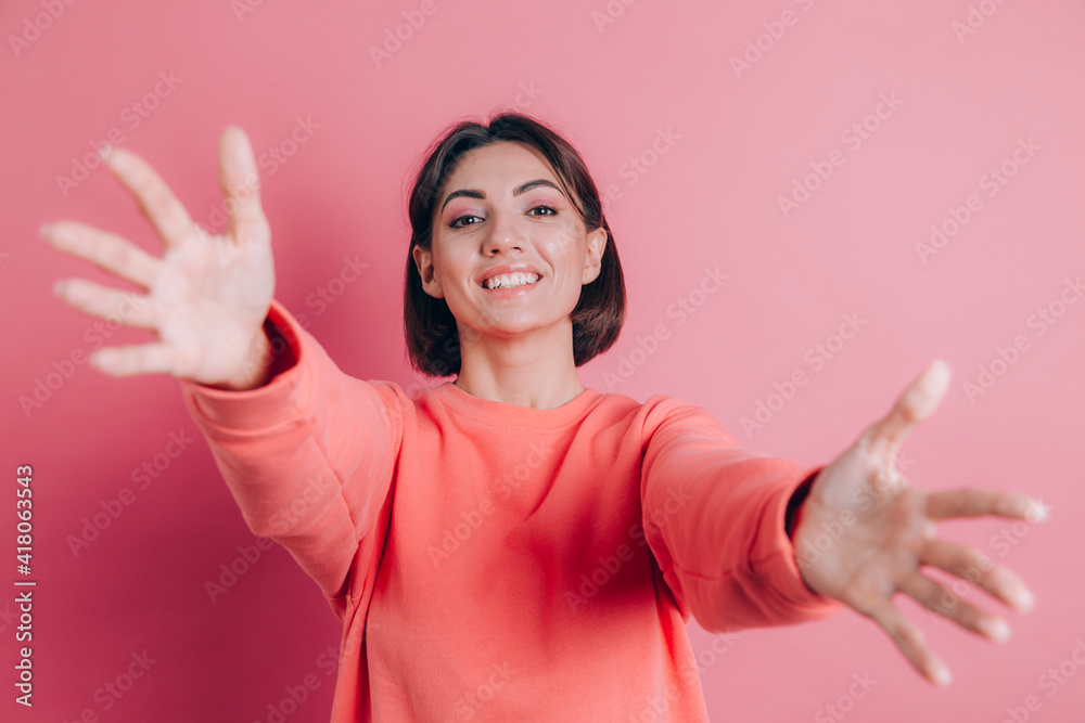 Woman wearing casual sweater on background looking at the camera smiling with open arms for hug Woman wearing casual sweater on background looking at the camera smiling with open arms for hug